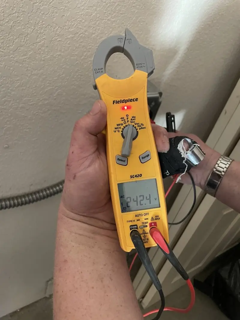 Voltage testing with clamp meter during Generator Installation in Sturgeon Bay